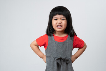 Portrait of Asian angry and sad little girl on white isolated background, The emotion of a child...