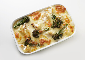 Appetizing broccoli and cauliflower gratin served on white table