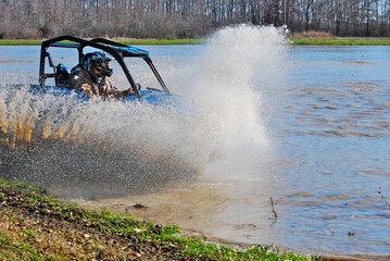 Four-wheeling in the mud and water 