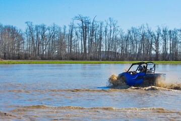 Four-wheeling in the mud and water 
