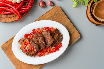 Jerado balado or Dendeng balado is a traditional cuisine from west sumatera, indonesia. it is made...
