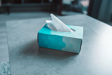 Blue tissue box on grey table background at home bedroom