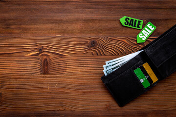 Discount shopping day - sale tag and wallet with banknotes and bank cards