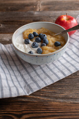 Light breakfast with high protein skyr, homemade applesauce and fresh blueberries