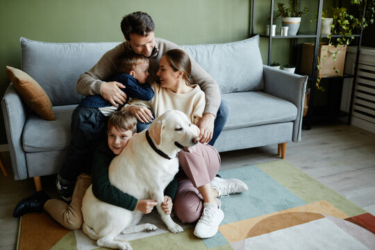 Full Length Portrait Of Big Happy Family With Two Kids And Dog All Embracing Lovingly, Copy Space