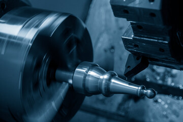 The  CNC lathe machine hi-precision cutting the  metal shaft parts.