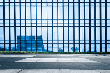   The glass curtain wall in front of the slate square - obrazy, fototapety, plakaty