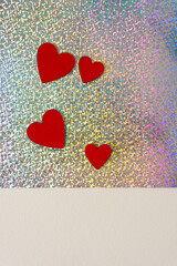 grungy red hearts on glitter paper