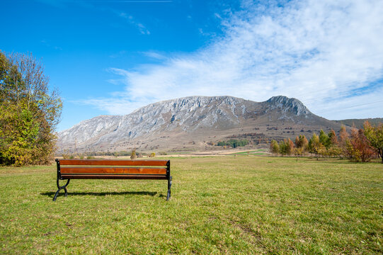 bench with a view to piatra secuiului mountain, romania, near rimetea