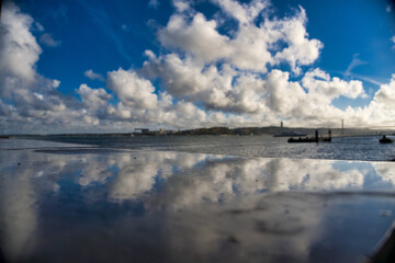 Beautiful view of the reflection of the cloudy sky and lake