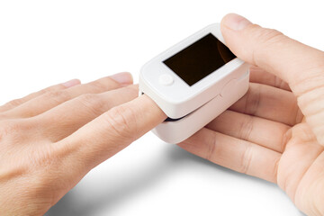 Woman hand holding pulse oximeter on finger to measuring saturation oxygen level and pulse rate...