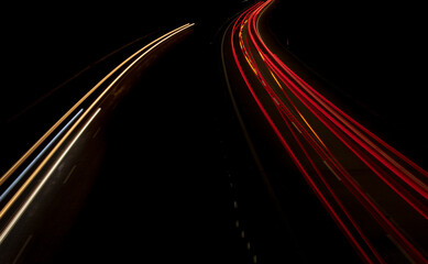 Fototapeta na wymiar Night road lights. Lights of moving cars at night. long exposure red, blue, green, orange.