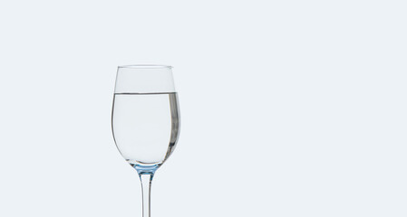 a glass of clean drinking water on a white background