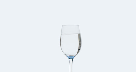 a glass of clean drinking water on a white background