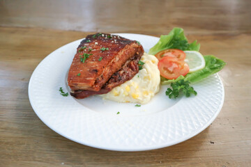 grilled pork , pork steak and beef steak or smoked pork