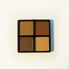 Palette. Eyebrow shadow. Eyebrow cosmetic designed to fill in sparse, light, or overly tweezed or plucked eyebrows.