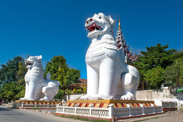 Mandalay, Myanmar - view of twin white lions at the entrance to Mandalay Hill