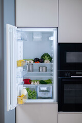 Picture of the fridge with food inside