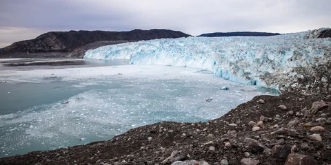Foto auf Acrylglas Landscape: Eqi glacier blue with blue ocean and rocks, Greenland  © vladimir