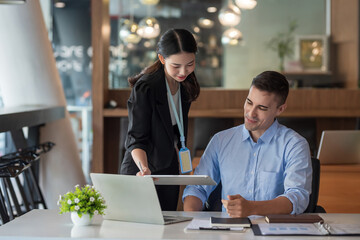 Businessman and businesswoman together new startup project idea presentation, analyze planning on tablet.