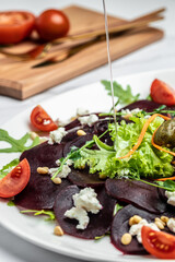 delicious beetroot carpaccio with feta, vertical image. top view. place for text