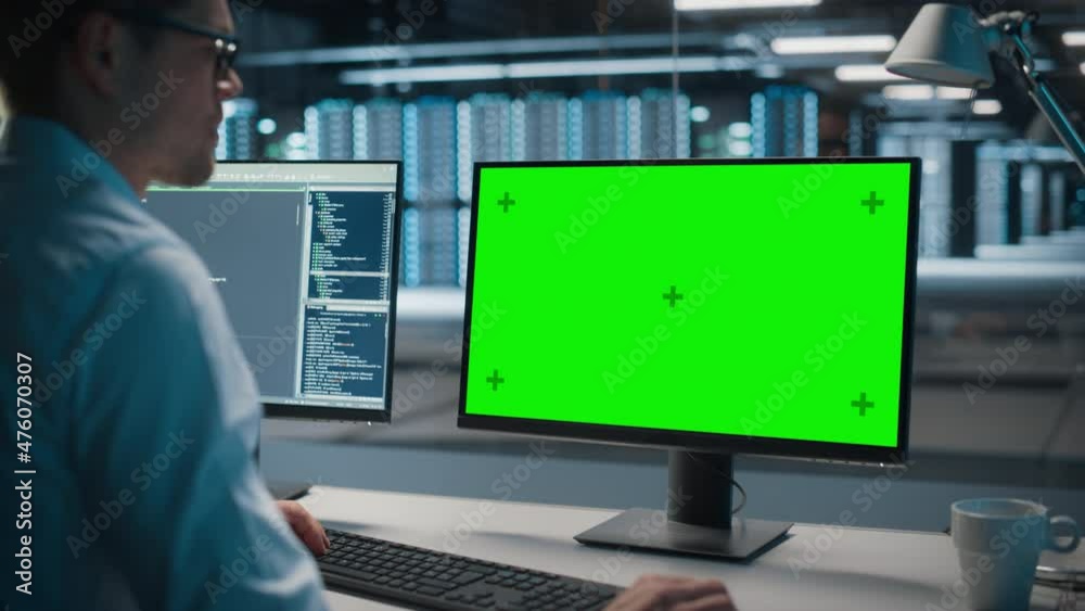 Poster High-Tech Data Center Server: IT Specialist Administrator Working on Green Screen Chroma Key Computer. Monitoring Web Services, Cloud Computing, Analytics Facility, Maintenance of Cyber Security