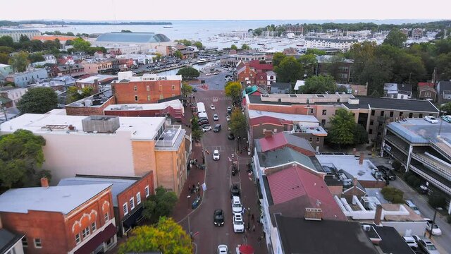 Drone shot of Main street in city of Downtown Annapolis, Maryland with traffic and tourist 