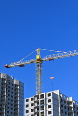 Fototapeta premium Crane and highrise construction site