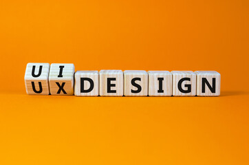 UX user experience design or UI user interface design symbol. Turned wooden cubes and changed words...