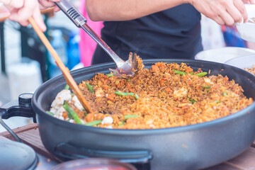 Marketplace with various food for sale. Eating on the street.