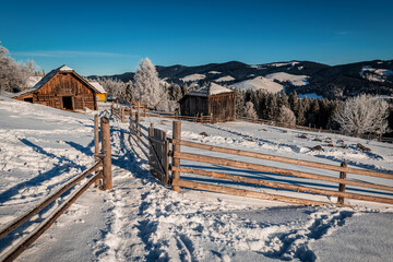 farm in winter mountain