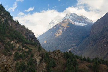 Buddhist stupa on a pathway in a himalayn deep valley