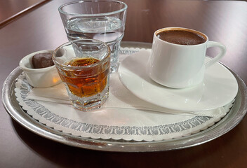 Turkish coffee with liquir , water and chocolate delight.