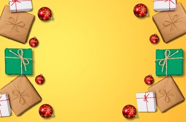 Merry Christmas and Happy Holidays greeting card, frame, banner. Christmas gifts red ribbons, ornaments on the desk.