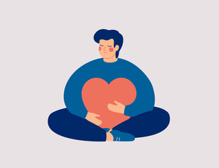 Young man embraces a big red heart with mindfulness and love. Smiling boy sits in lotus pose with closed eyes and enjoys his freedom and life. Body positive and mental health concept. - 476075770