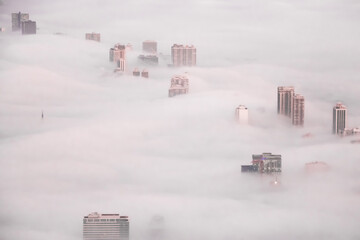 city in the fog - 476077520