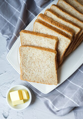 Slices of Whole wheat sandwich bread and butter