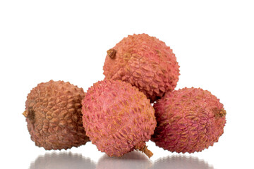 Several ripe organic litchi fruit, close-up, isolated on white.