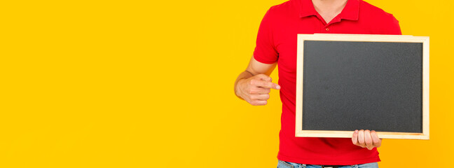 cropped guy with bristle point finger on chalkboard with copy space, announcement.