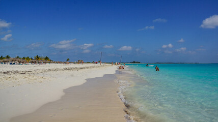 Cuba, February 2012, turquoise sea and white sand beach against blue sky