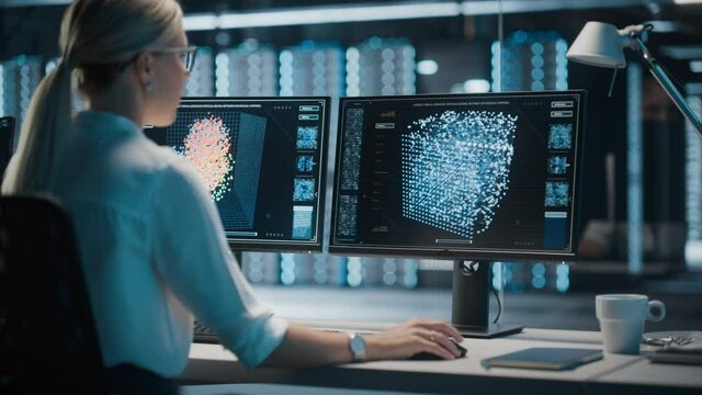 High-Tech Data Center Server Control: IT Specialist Administrator Working on Computer, Screen Showing Advancing Big Data AI Analysis. Web Services, Cloud Computing, Analytics Facility, Cyber Security