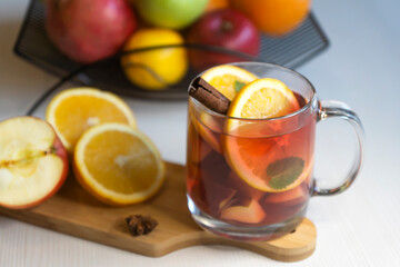 Fruit tea, various fruits in a basket on the table. Calendar 2022, winter mood and spruce branches.