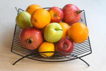 Fruit tea, various fruits in a basket on the table. Calendar 2022, winter mood and spruce branches.