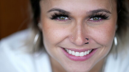 Naklejka premium Woman face smiling extreme close-up eyes and smile
