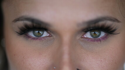 Obraz premium Woman eyes macro close-up closing eye in meditation. Person opening eyes looking at camera