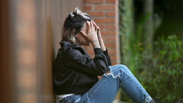 Woman feeling regret covering face with hand ashamed