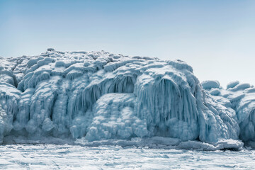 Frozen lake Baikal with rocks covered with ice. Eastern Siberia, Russia