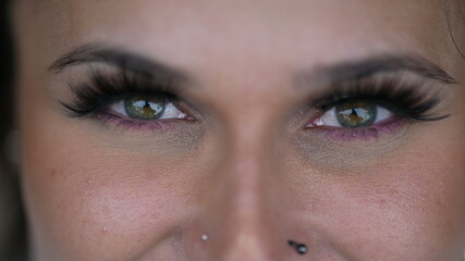 Fototapeta premium Person eyes macro extreme close-up staring at camera. Woman green eye