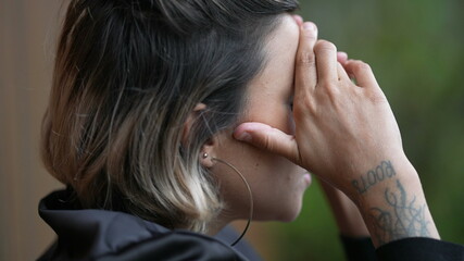 Naklejka premium Person covering face with hands feeling ashamed. Woman in despair and depression