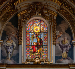 Stained glass window and fresco paintings in St Pauls cathedral in the city Mdina, Malta.